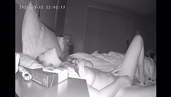 A Reserved Woman Pleasures Herself Alone In Bed, Captured By A Hidden Camera